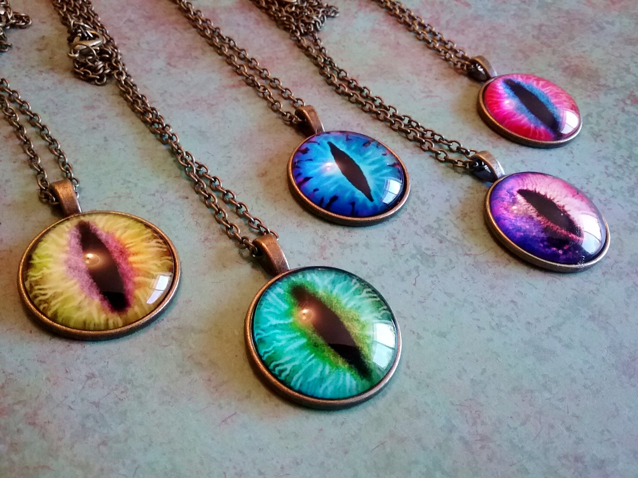 Dragon eye necklace meaning on sale